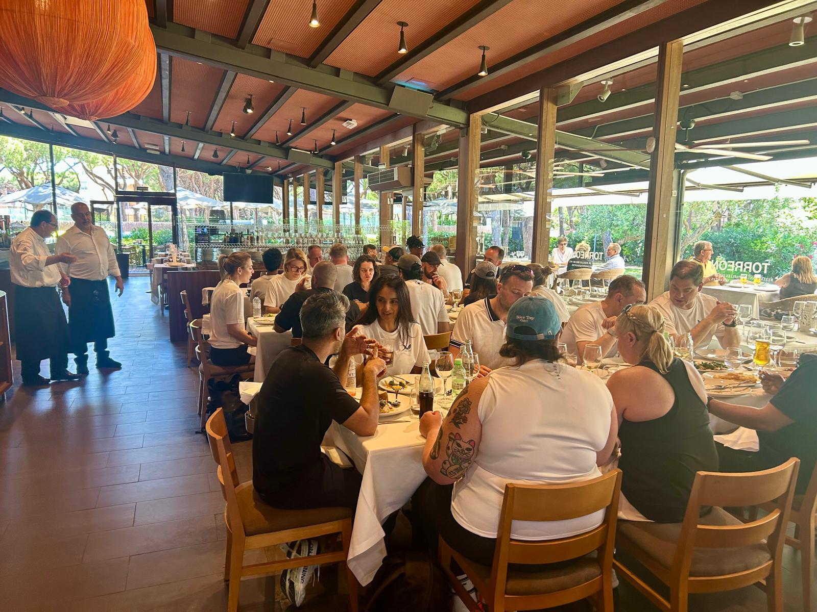 Club members sharing a meal together at a restaurant