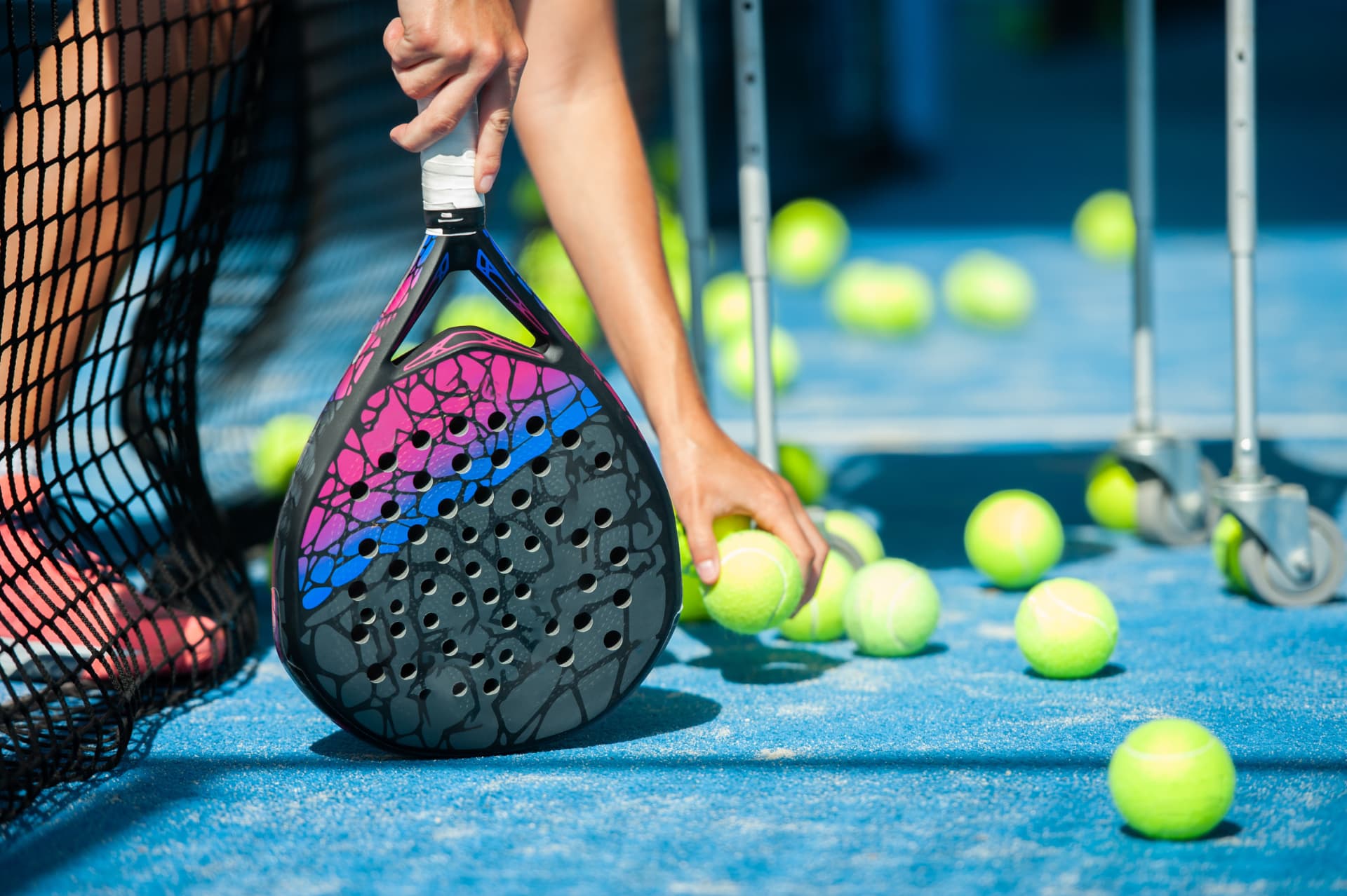 A coach showing beginners padel technique
